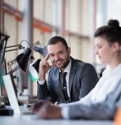 Professionals collaborating at a desk